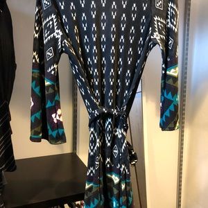 Beautiful cowl nick knit dress with belt.